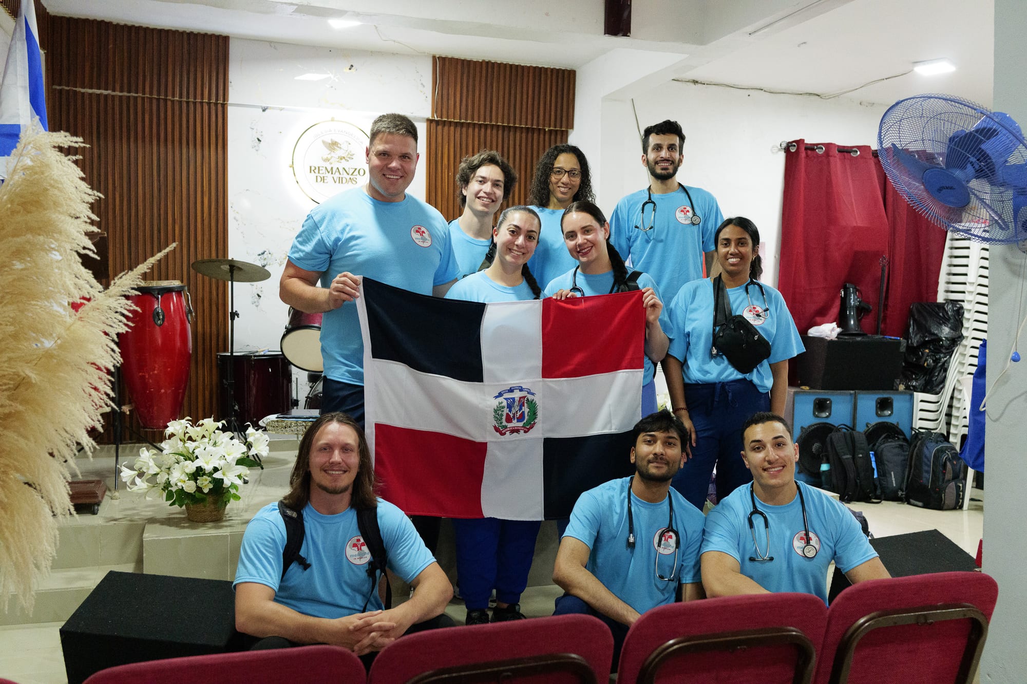 The Medicine in Mission team with the Dominican flag at a local church partner