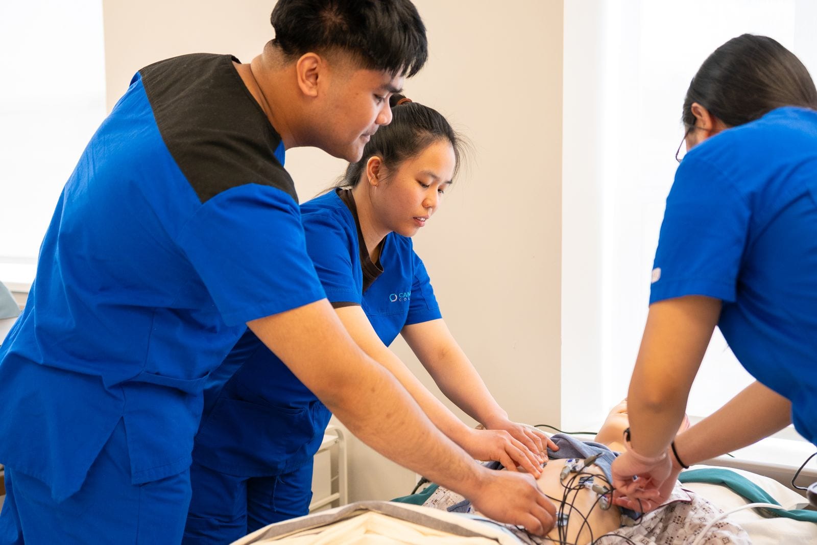 Nursing and medical students practicing clinical skills