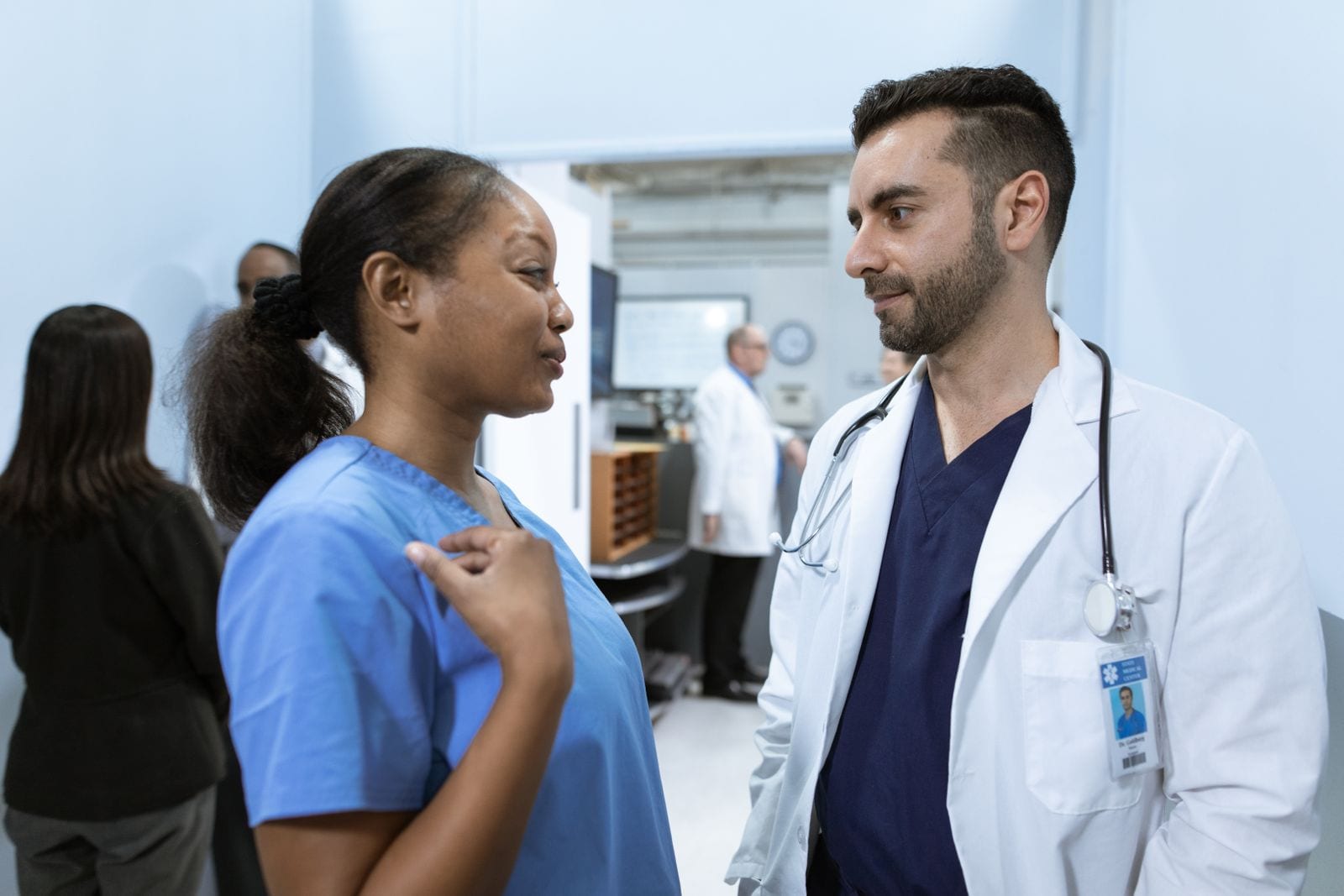 Two healthcare workers in discussion at a hospital